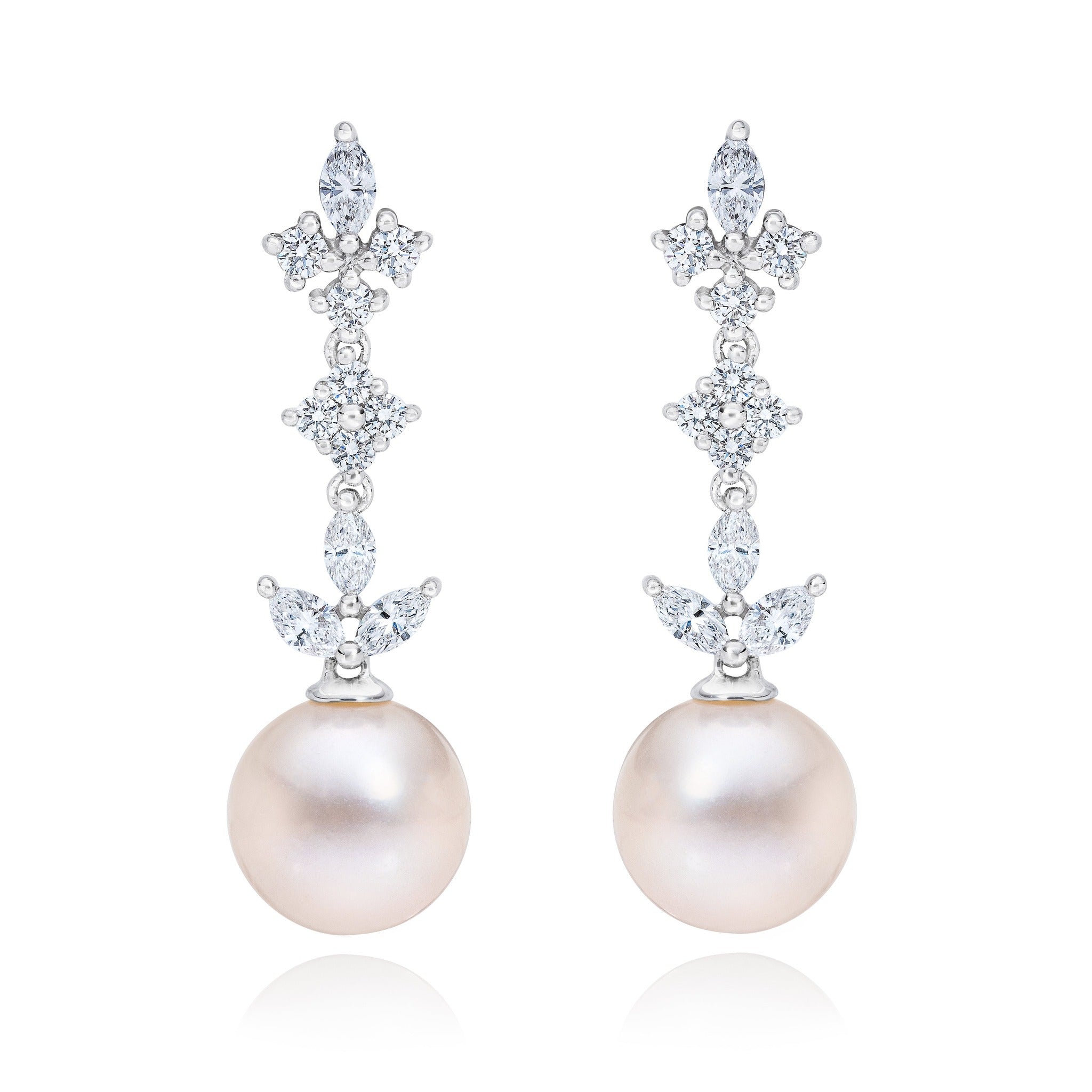 ISAAC WESTMAN® 14k gold diamond and freshwater pearl dangle earrings showing elegant jewelry with sparkling diamonds and lustrous pearls.