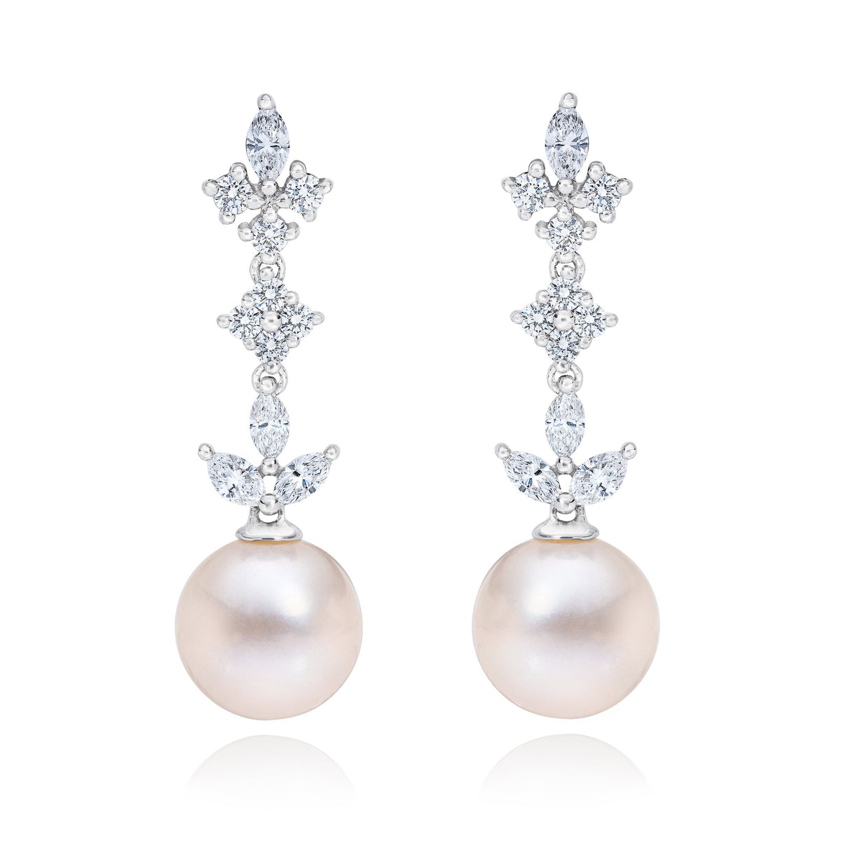 ISAAC WESTMAN® 14k gold diamond and freshwater pearl dangle earrings showing elegant jewelry with sparkling diamonds and lustrous pearls.