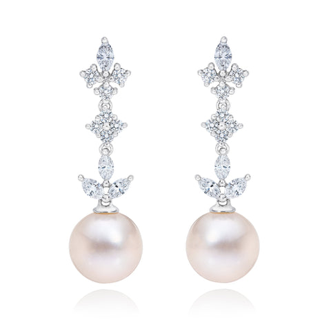 ISAAC WESTMAN® 14k gold diamond and freshwater pearl dangle earrings showing elegant jewelry with sparkling diamonds and lustrous pearls.