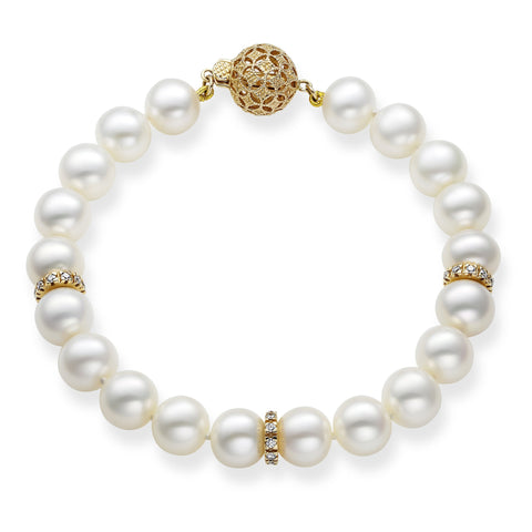 Elegant 14k gold bracelet by Isaac Westman featuring diamonds and pearls, showcasing a luxurious and sophisticated jewelry design.