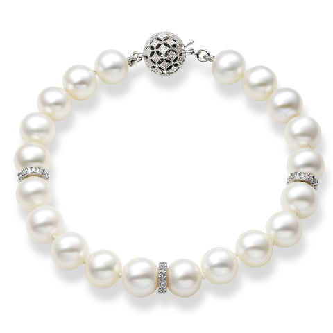 Elegant Isaac Westman® 14k white gold diamond and pearl bracelet showcasing sparkling diamonds and lustrous pearls.
