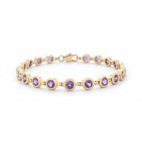 ISAAC WESTMAN® Luminance 14K yellow gold amethyst bracelet with polished gold links and a central amethyst gemstone.