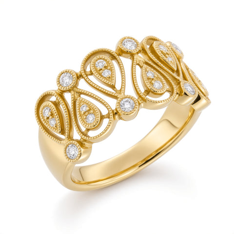 A yellow gold ring with an intricate filigree design set with small round diamonds, shown on a clean white background.