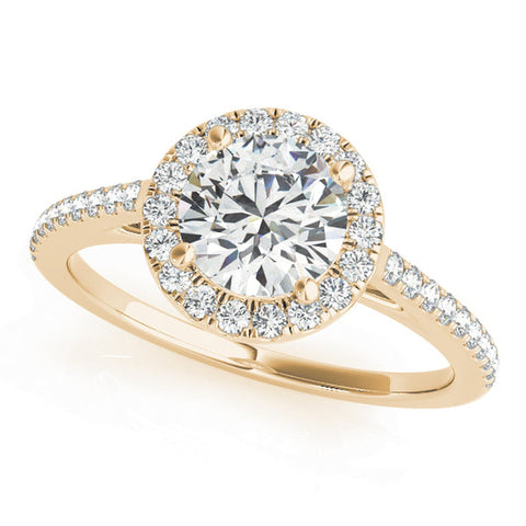Halo diamond engagement ring by ISAAC WESTMAN®, featuring a central diamond surrounded by a halo of smaller diamonds.