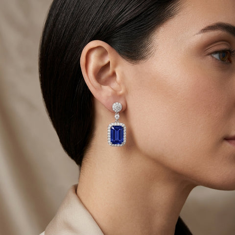 Model wearing ISAAC WESTMAN tanzanite and diamond drop earrings in 18K white gold