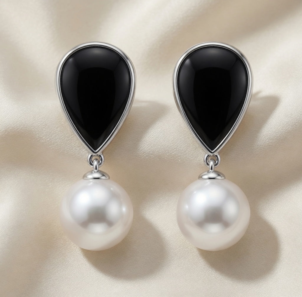 14K white gold dangle earrings with black onyx and pearl accents by ISAAC WESTMAN. Elegant jewelry for special occasions.