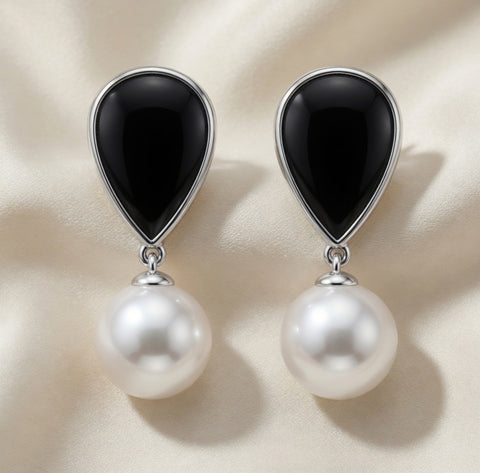 14K white gold dangle earrings with black onyx and pearl accents by ISAAC WESTMAN. Elegant jewelry for special occasions.