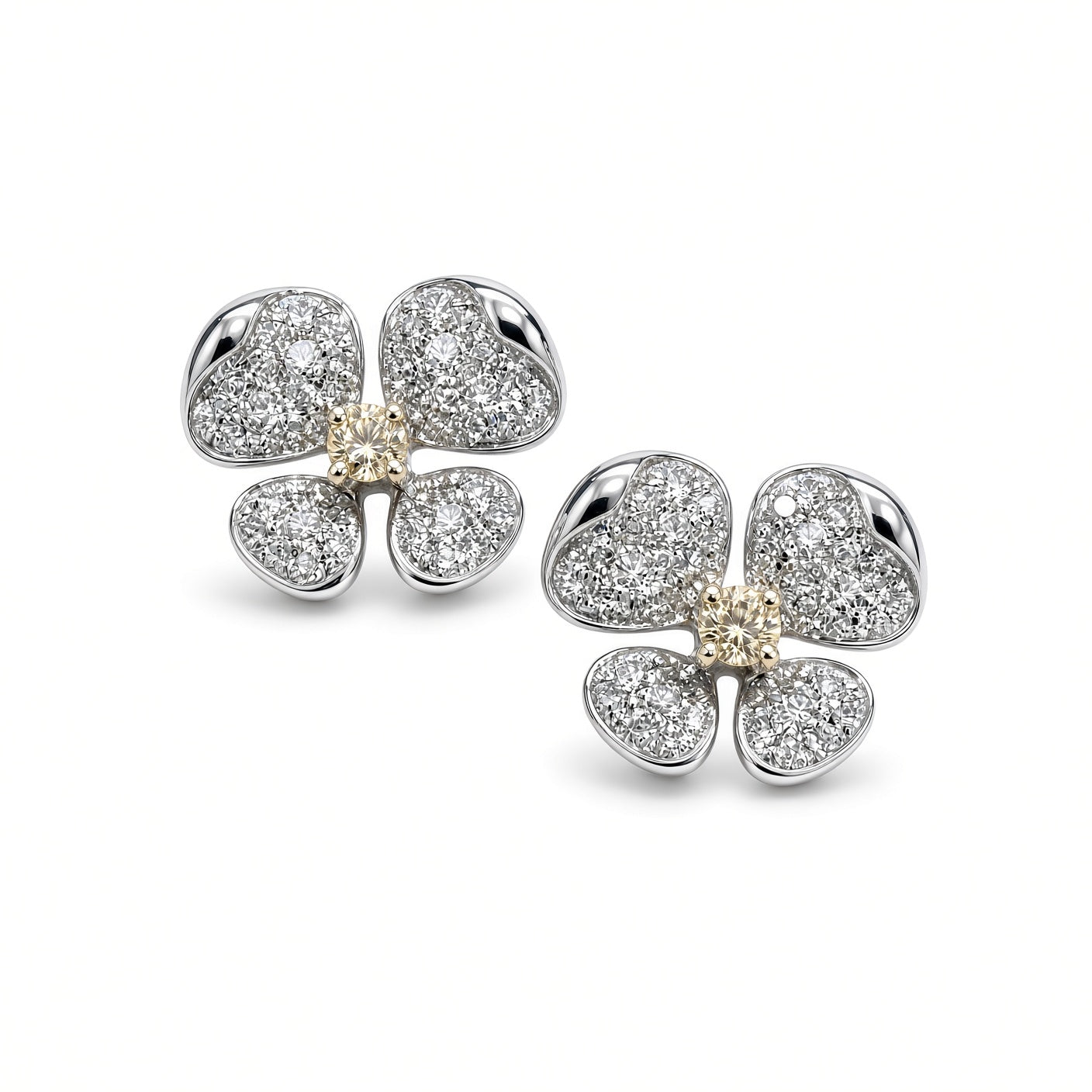 Pair of pavé diamond flower earrings with yellow diamond centers on white