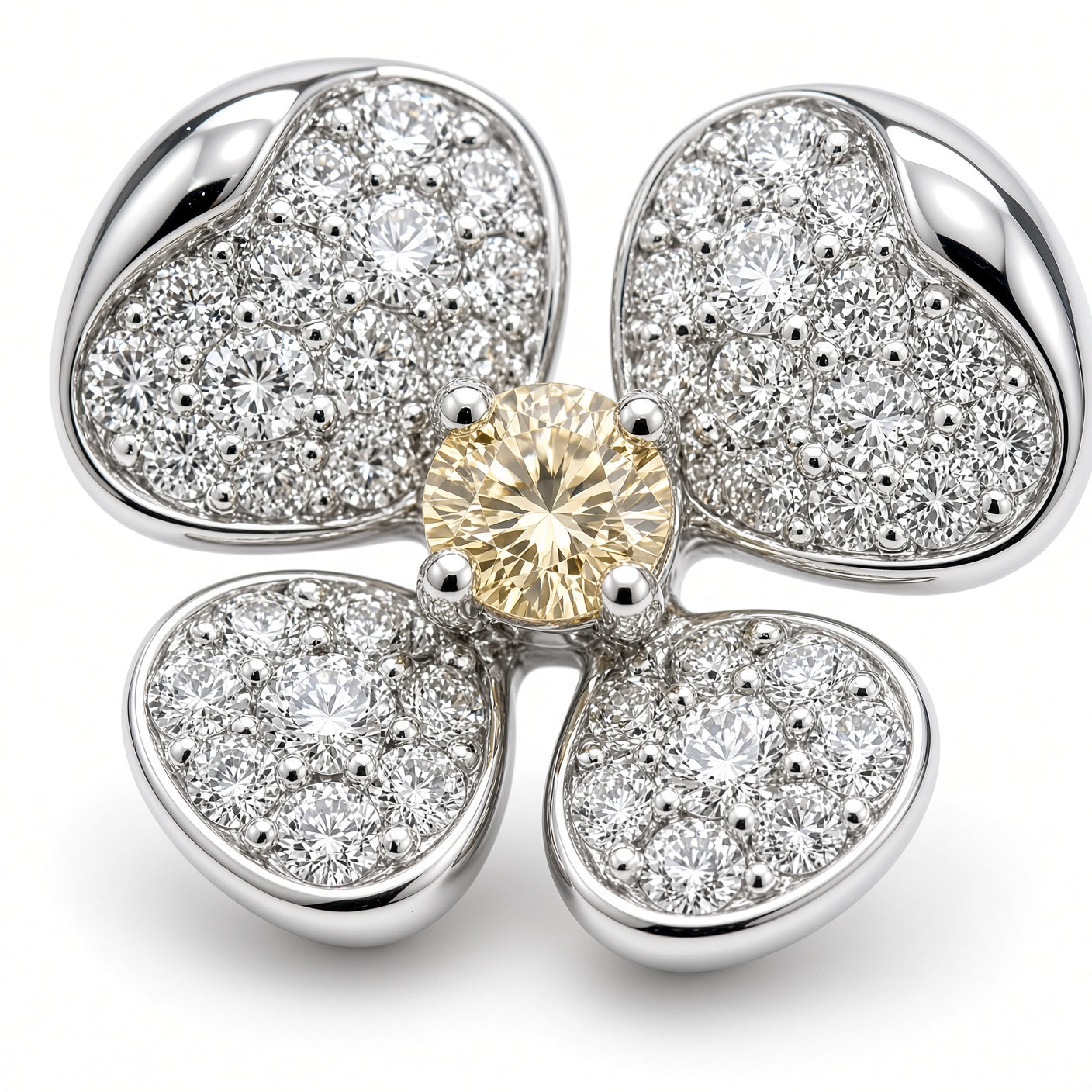 Close-up of a diamond flower earring showing pavé petals and a four-prong yellow diamond center