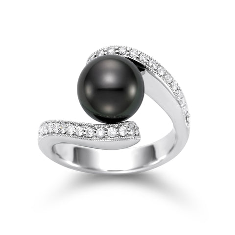 A 14K white gold ring featuring a large Tahitian pearl with smaller diamonds set along the band.