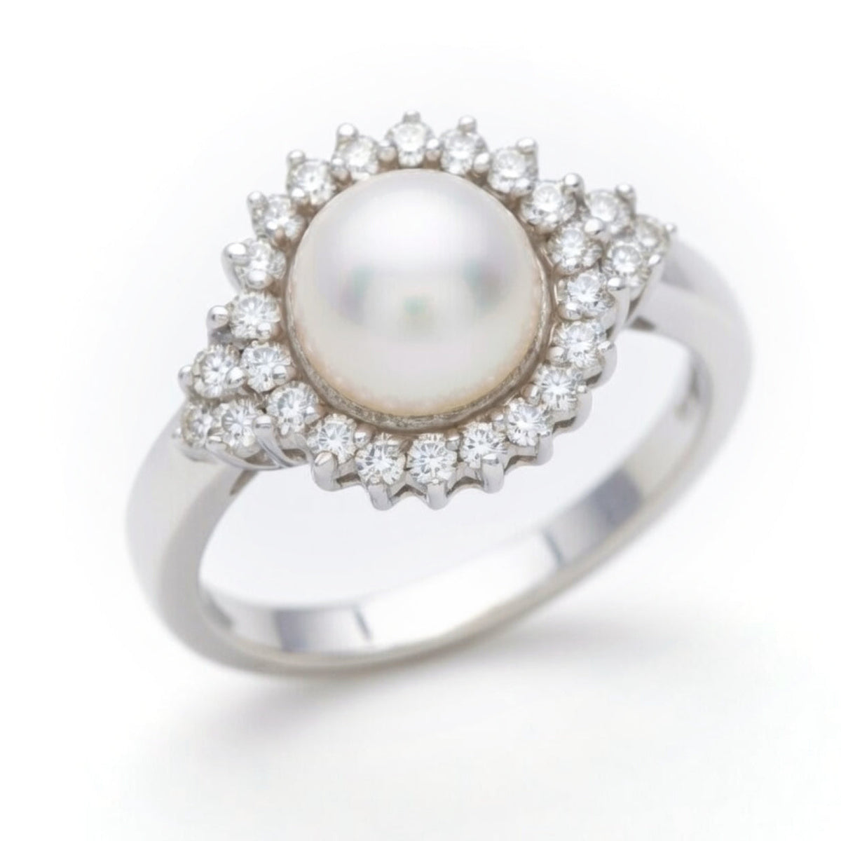 Elegant diamond and pearl ring by ISAAC WESTMAN® featuring sparkling stones set in a stylish ring design.