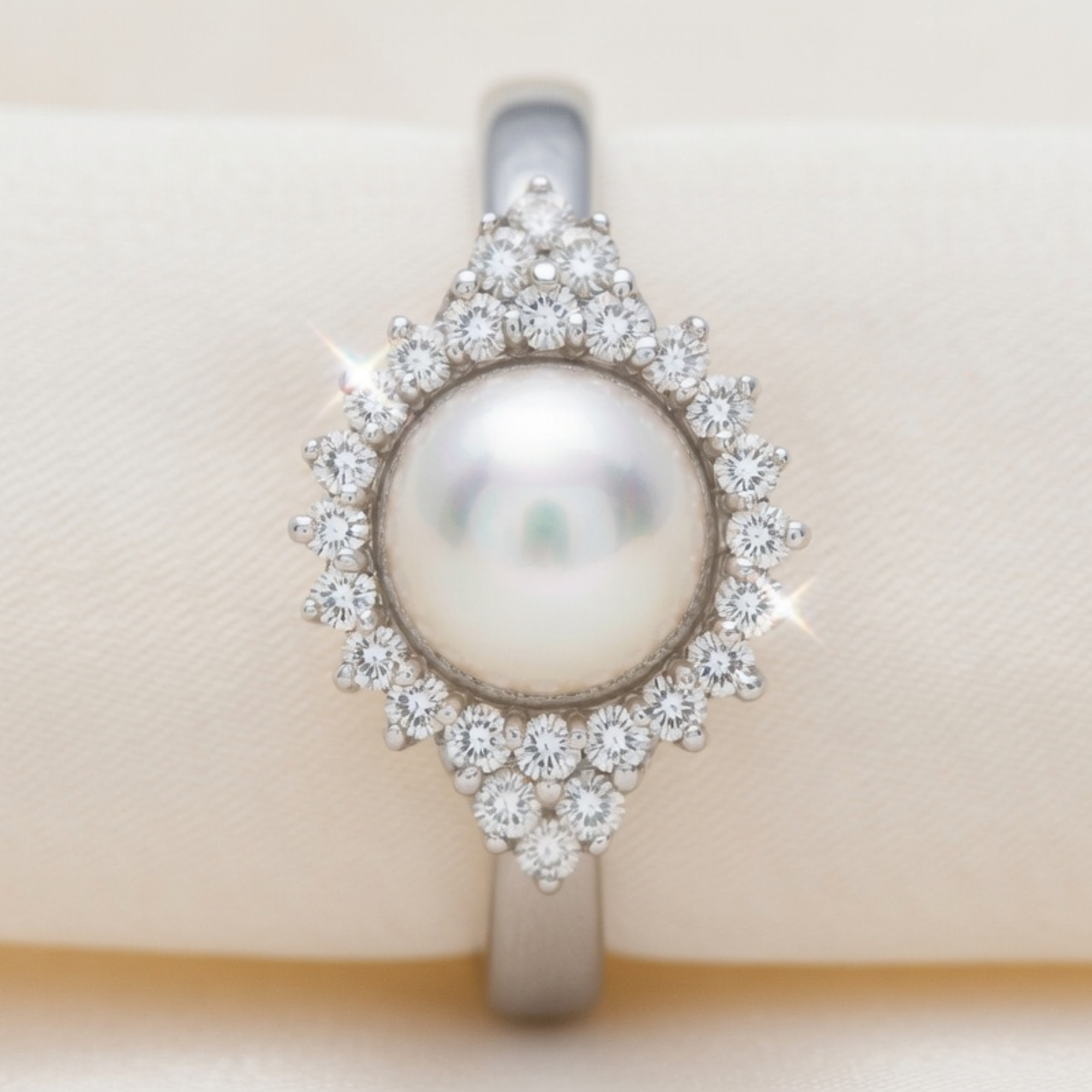 Diamond and pearl ring by ISAAC WESTMAN®, showcasing a sparkling diamond accent and elegant pearl centerpiece.