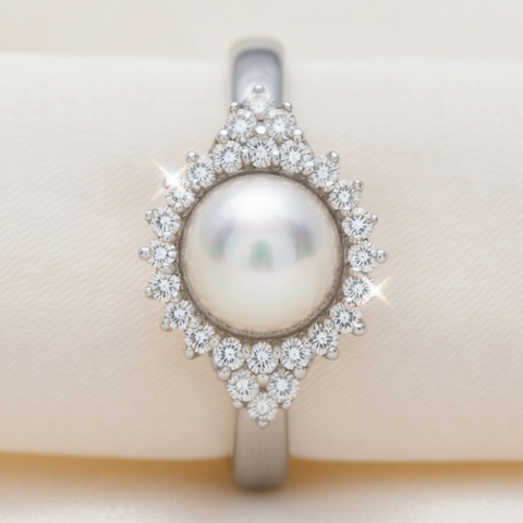 Diamond and pearl ring by ISAAC WESTMAN®, showcasing a sparkling diamond accent and elegant pearl centerpiece.