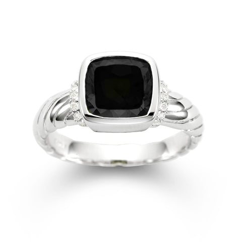 Black Onyx and diamond ring by Isaac Westman featuring a sleek black gemstone and sparkling diamonds on a silver band.