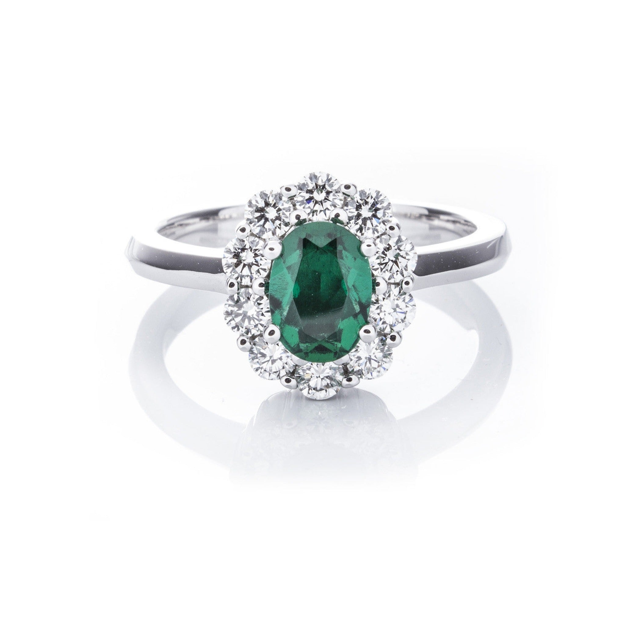 Isaac Westman® created emerald and diamond ring with a central emerald gemstone surrounded by sparkling diamonds.