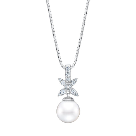 ISAAC WESTMAN diamond and freshwater pearl pendant featuring a sparkling diamond set above a lustrous freshwater pearl.