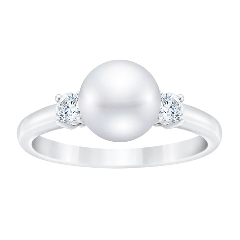 Diamond and freshwater pearl ring by ISAAC WESTMAN featuring a sparkling diamond and lustrous pearl on a sleek band.