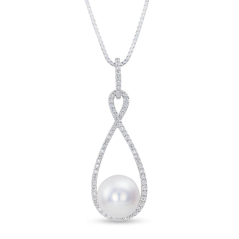 Isaac Westman freshwater pearl and diamond pendant hanging on a chain, showcasing elegant jewelry design and sparkling accents.