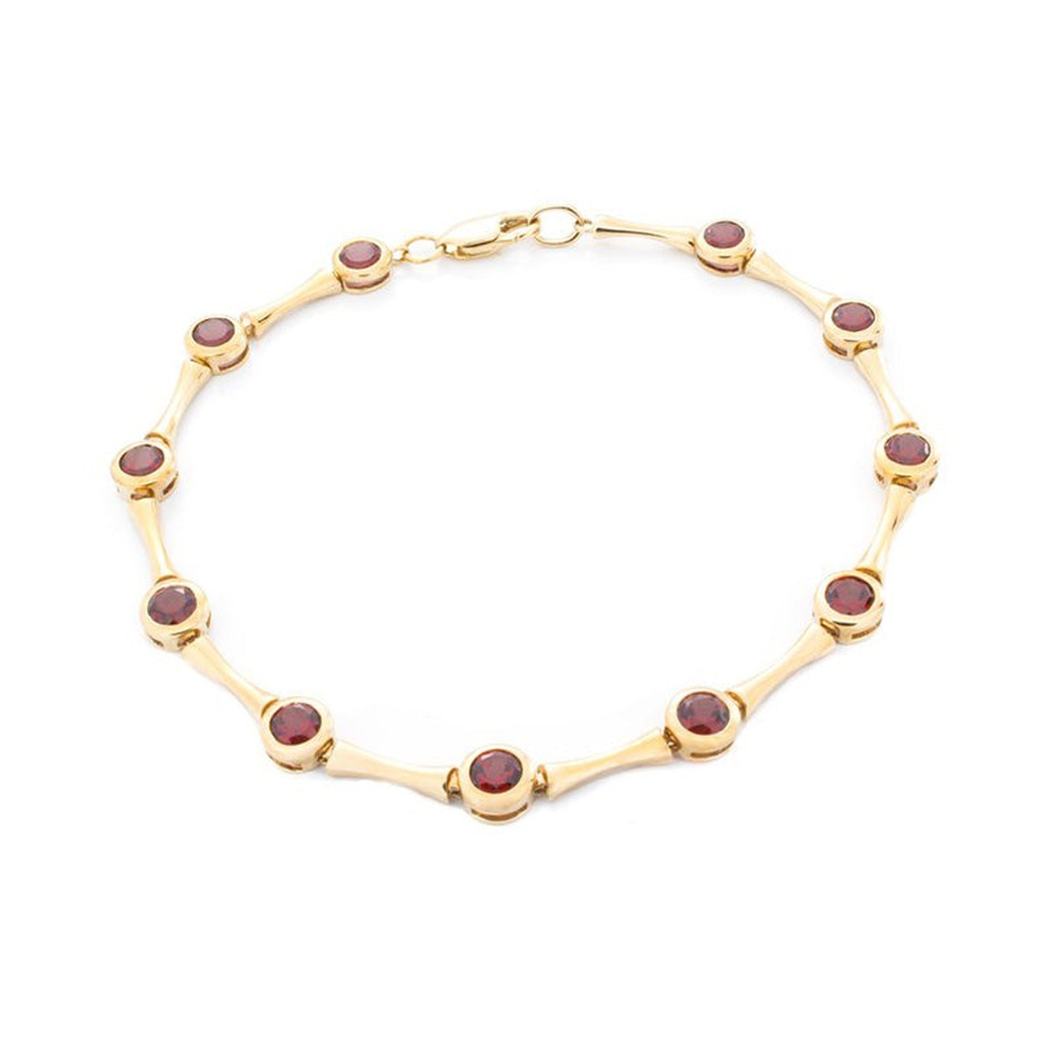 Isaac Westman garnet gold bracelet with red garnet stones and yellow 14K gold links, close-up view of elegant jewelry design.