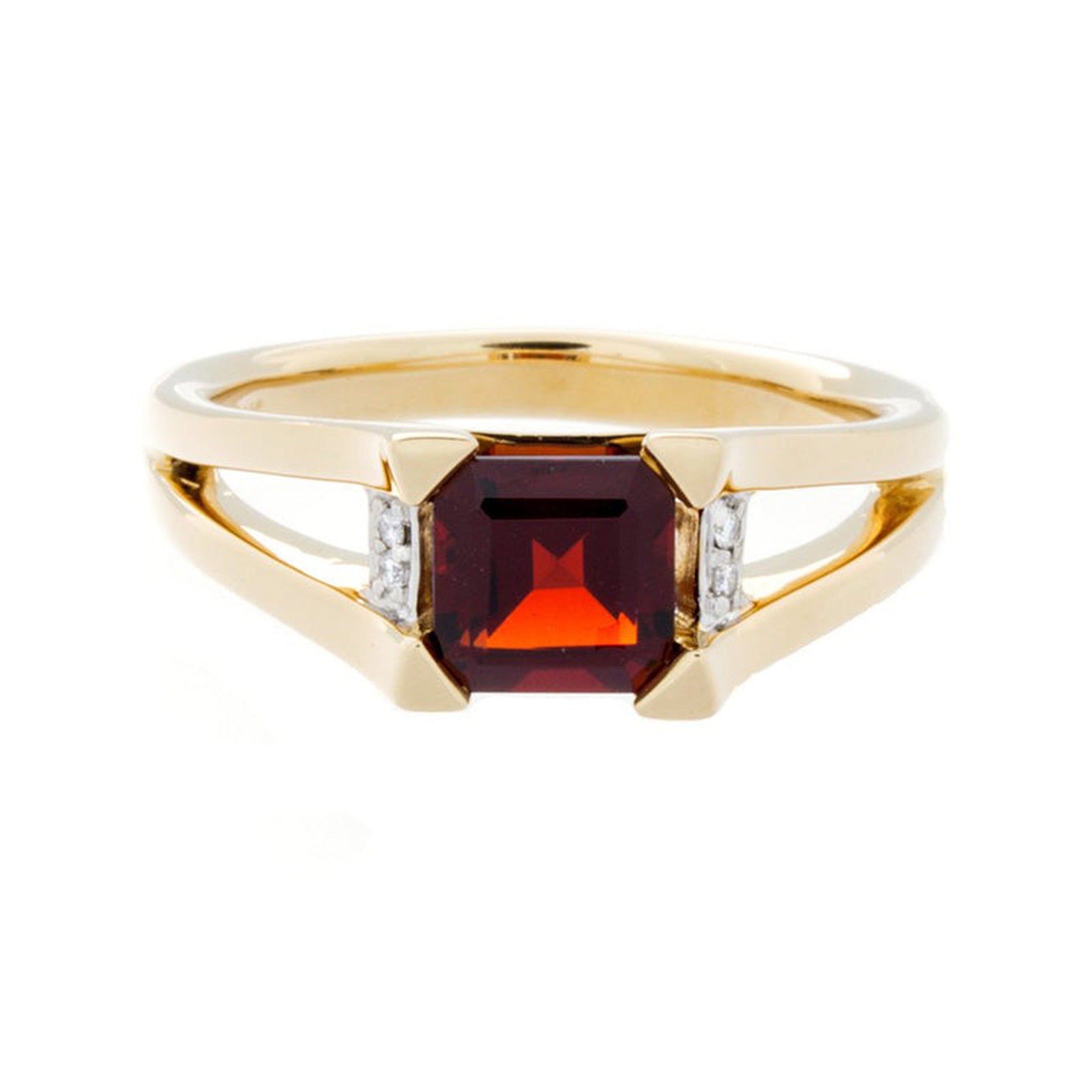 Isaac Westman garnet gold ring showcasing a deep red garnet gemstone set in a gold band.