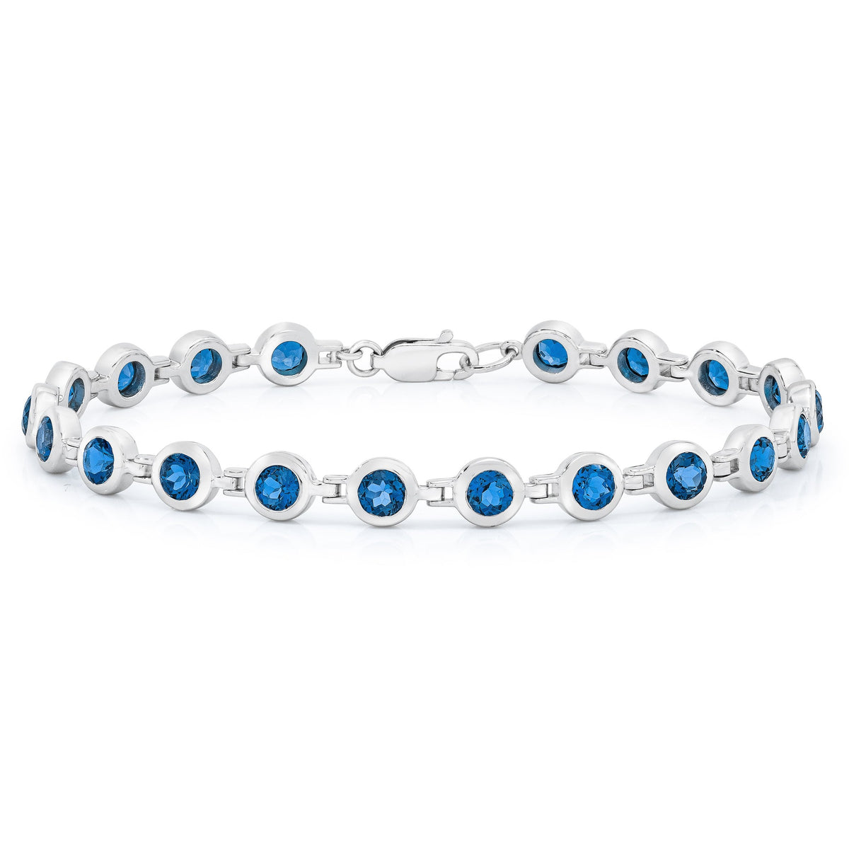ISAAC WESTMAN® London Blue Topaz bracelet featuring oval blue topaz stones and silver chain on a neutral background.