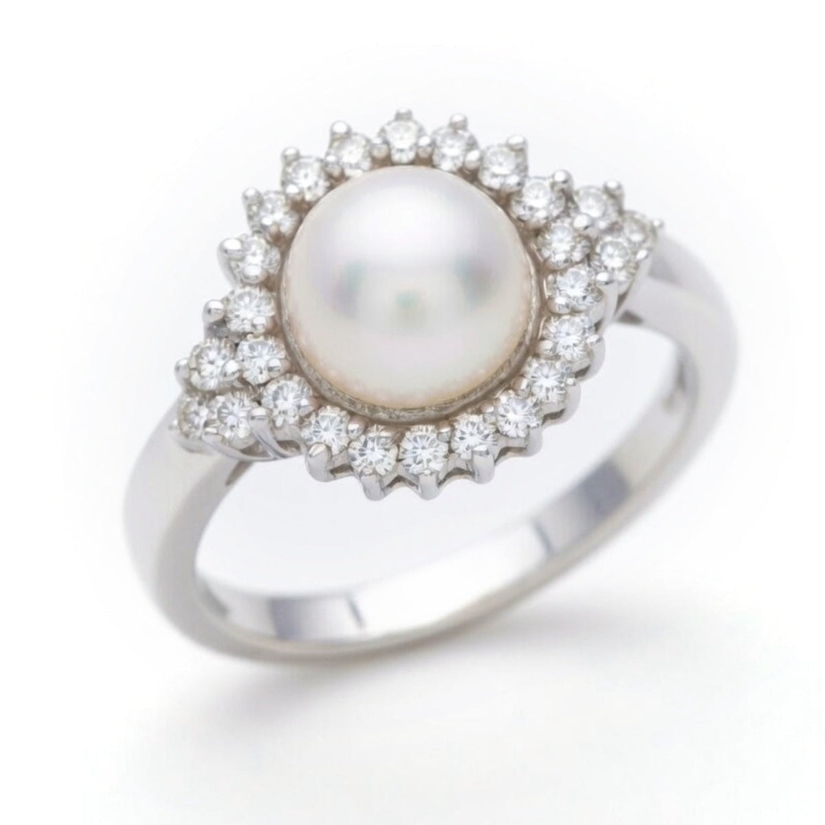 Diamond and pearl ring by ISAAC WESTMAN® featuring a sparkling diamond and lustrous pearl set in a stylish ring design.