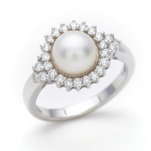 Diamond and pearl ring by ISAAC WESTMAN® featuring a sparkling diamond and lustrous pearl set in a stylish ring design.