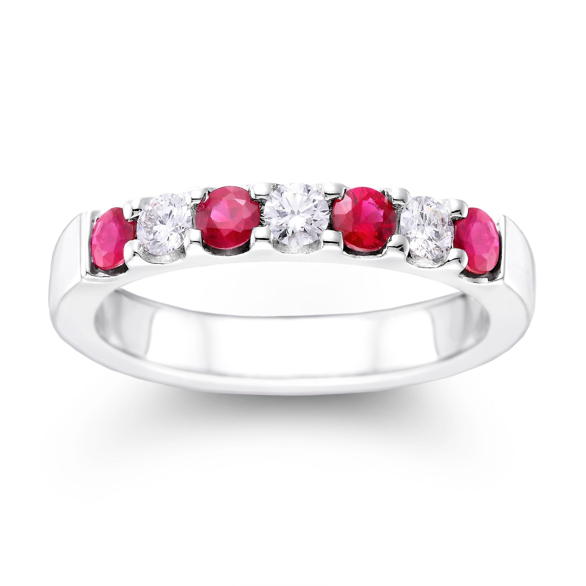 ISAAC WESTMAN® Ruby and diamond ring showcasing a vibrant ruby centerpiece surrounded by sparkling diamonds.