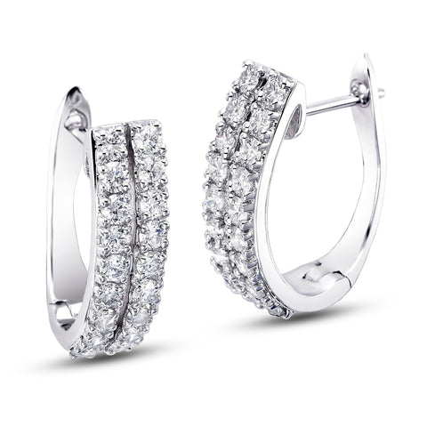 Two-row diamond huggie earrings by ISAAC WESTMAN® featuring sparkling diamonds and a sleek gold hoop design.