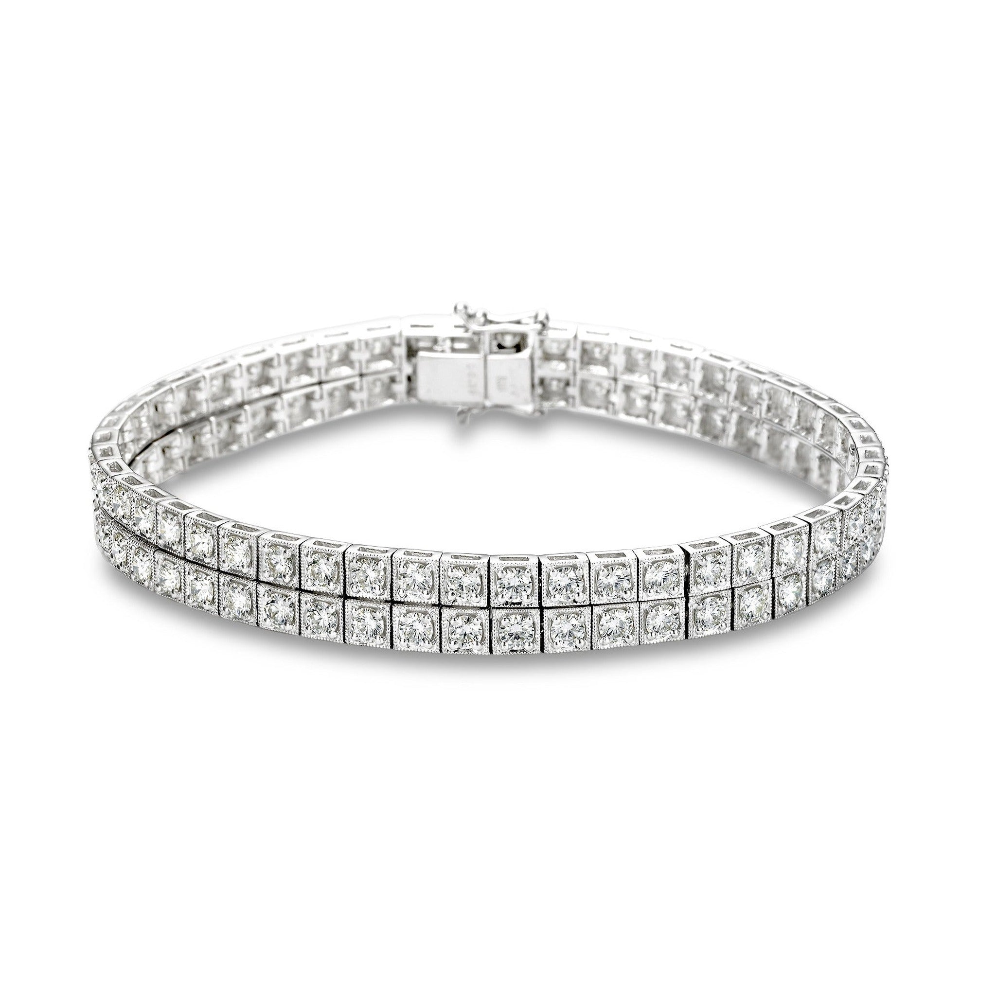 Isaac Westman two-row diamond tennis bracelet with 6.6 carats total weight, featuring sparkling diamonds on a sleek silver setting.